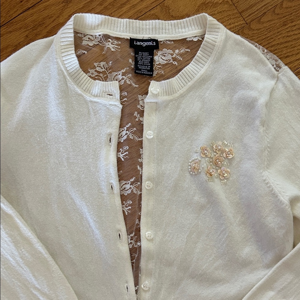 Langenis Cream Crewneck Cardigan with lace back.